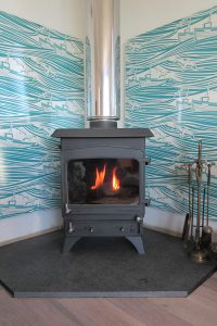freestanding corner stove with wall mounted heat shields